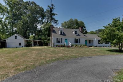 Cape cod-style house featuring a front yard | Image 2