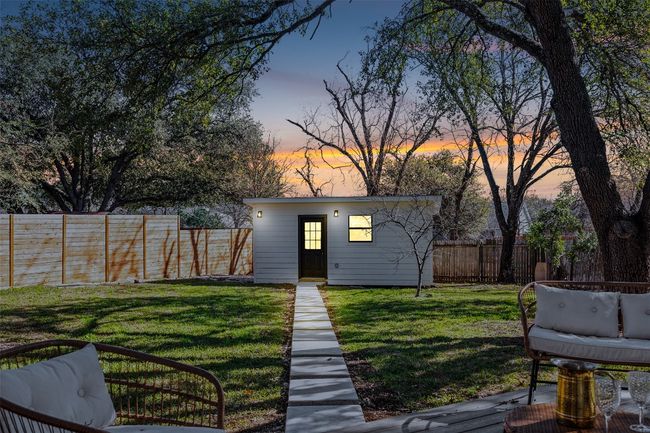 Yard at dusk with an outdoor structure | Image 30