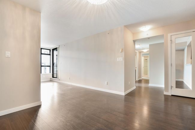 Unfurnished room with dark wood-type flooring and baseboards | Image 9