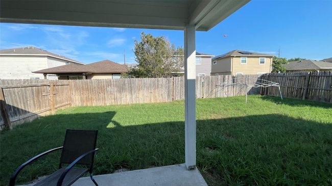 View of fenced backyard | Image 20