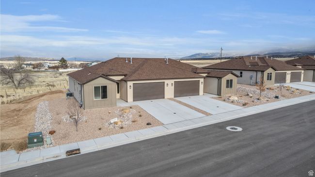 Ranch-style house with a mountain view and a garage | Image 34