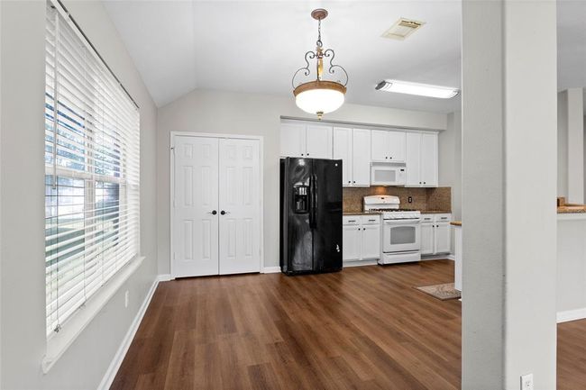 The Kitchen has a large pantry. | Image 9