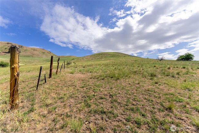 Walk up the fence-line to top of property to enjoy views all around. | Image 18
