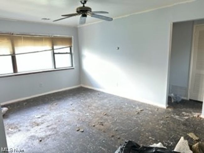 Unfurnished room featuring ceiling fan | Image 5