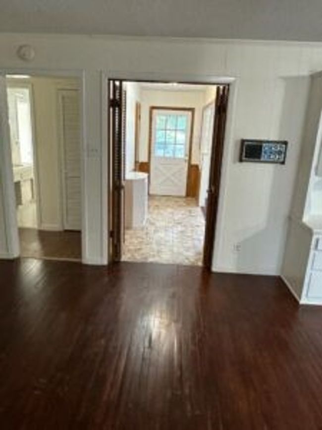 Hall featuring wood finished floors | Image 9