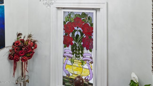 Gorgeous back lit stained-glass window in the staircase. | Image 9