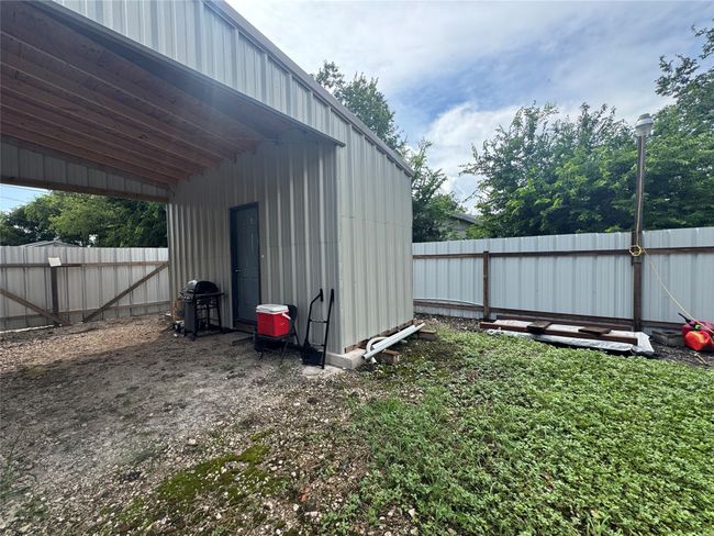 View of outbuilding featuring a fenced backyard | Image 20