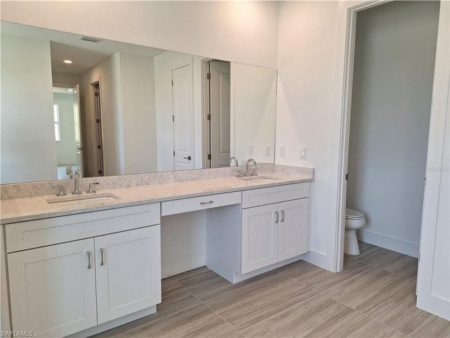 Primary bathroom with dual-sinks and private water closet | Image 14