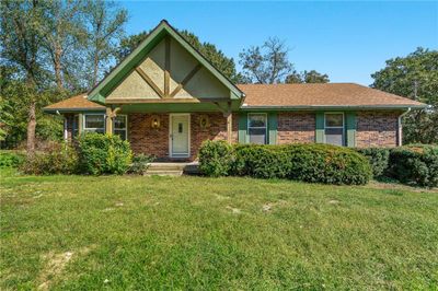 View of front of property with a front lawn and a porch | Image 1