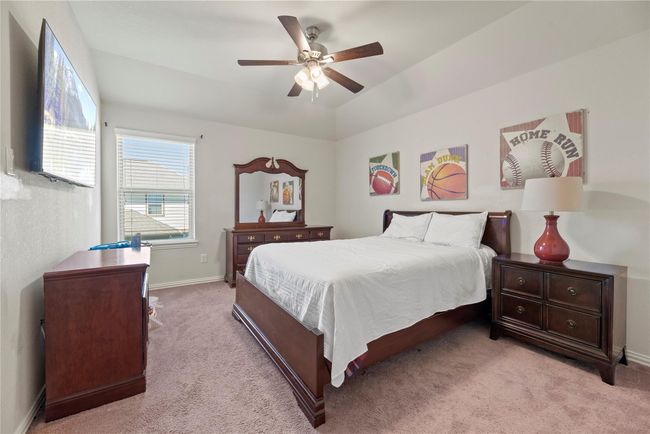 Soothing color schemes are good for the soul, and this home delivers magnificently! The kiddos and your guests will sleep with complete ease in these calming bedrooms. | Image 29