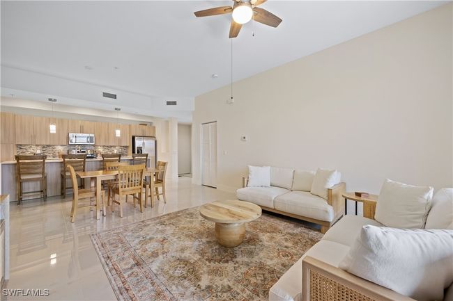 Living area featuring visible vents and a ceiling fan | Image 21