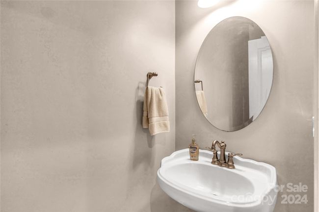 Half bathroom located downstairs | Image 14