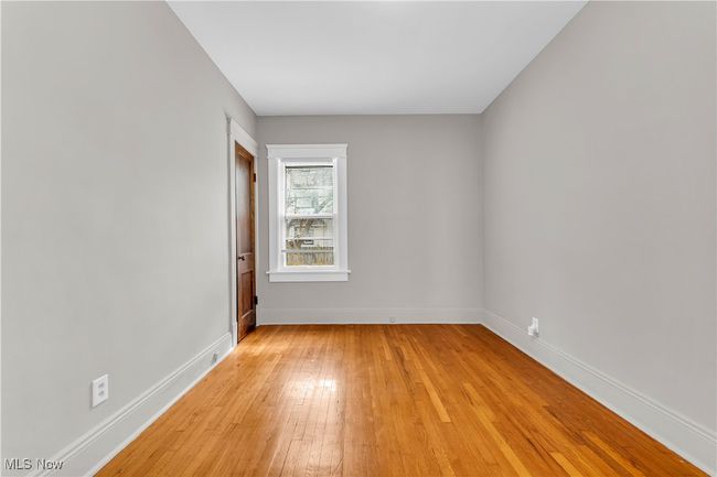 Unfurnished room with light wood-style flooring and baseboards | Image 15
