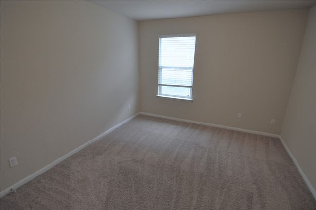 Empty room with baseboards and light carpet | Image 7