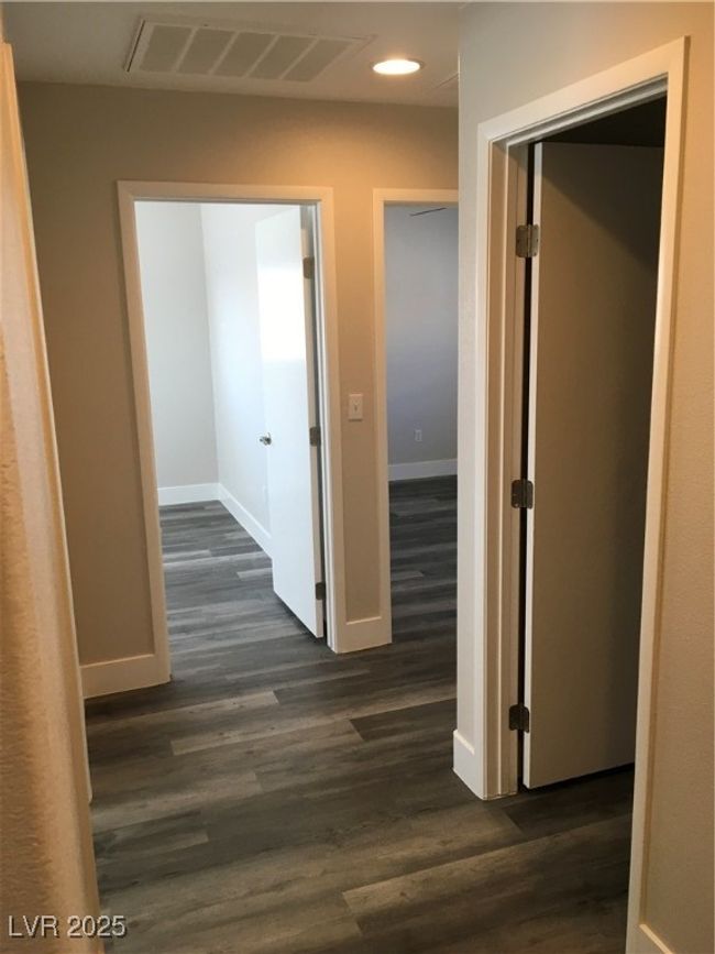 Hall featuring baseboards, recessed lighting, visible vents, and dark wood finished floors | Image 16