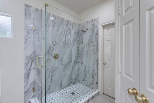 Bathroom with a marble finish shower | Image 21