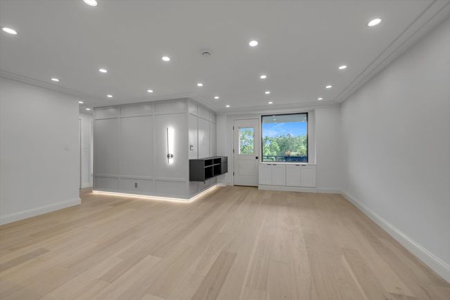 Unfurnished living room with light wood-type flooring, recessed lighting, and ornamental molding | Image 6