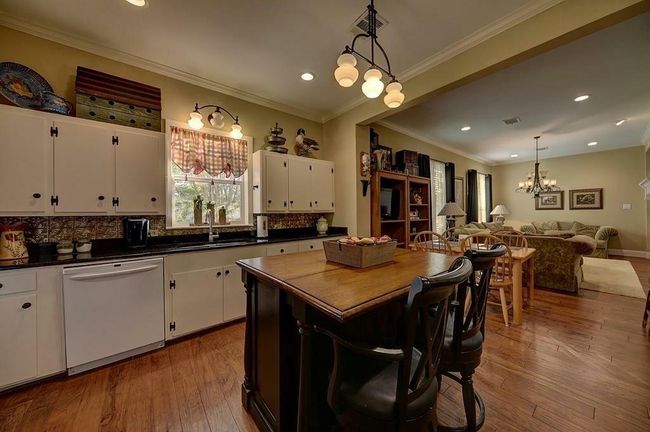 The heart of the home is open to the breakfast area and sitting room.Perfect for large gatherings. | Image 8