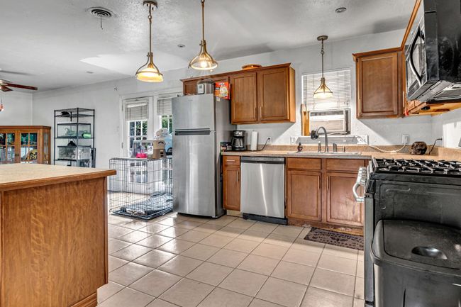 Here's Our First Look At The Kitchen, Dining Area And Second Living Area. | Image 4