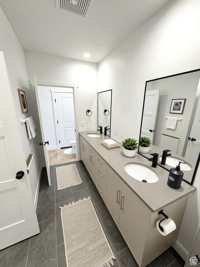 Bathroom with double vanity and recessed lighting | Image 6