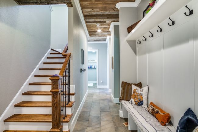 Mudroom with barn wood ceiling, ornamental molding, and baseboards | Image 24