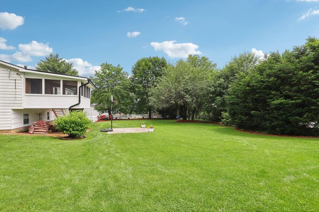 Raised ranch with a chimney and brick siding | Image 35