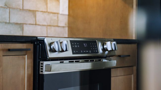 Kitchen view of dark countertops | Image 29
