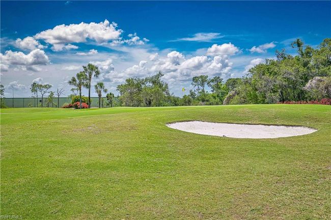 View of yard featuring view of golf course | Image 7