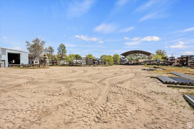 View of yard featuring fence and an outdoor structure | Image 13