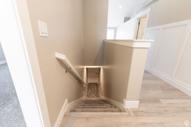 Stairway with wood finished floors and baseboards | Image 13