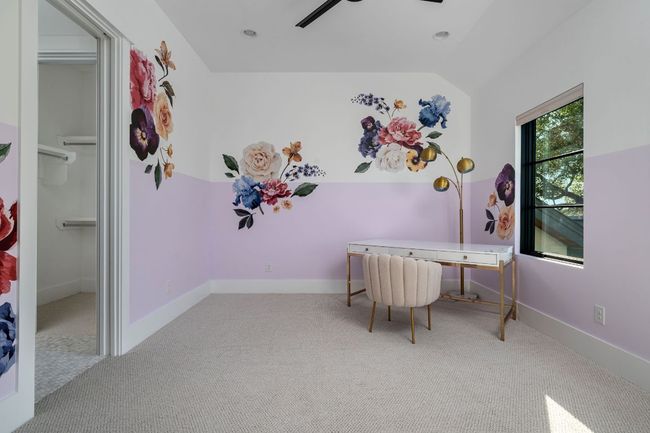 Carpeted office featuring ceiling fan, baseboards, and vaulted ceiling | Image 25