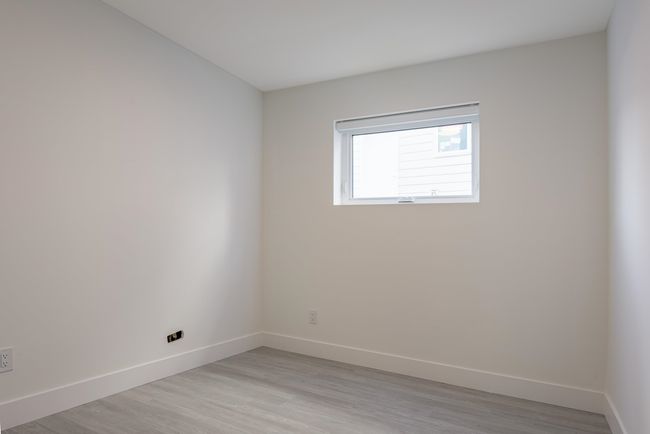 Spare room with baseboards and light wood finished floors | Image 36