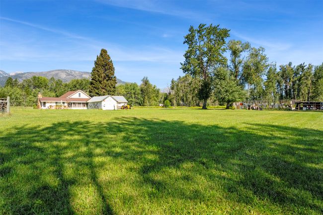 View of grassy yard with a mountain view | Image 15