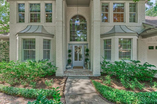 On-trend exterior, tasteful entry and stylish awning over windows equals Stately design. | Image 4
