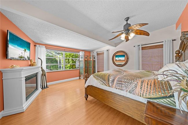 Main Home - Primary Bedroom with a perfect view of the lake. | Image 46