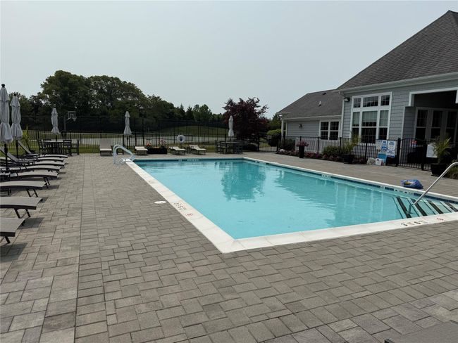 Community pool featuring a patio area | Image 25