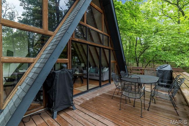 Deck featuring outdoor dining space | Image 64
