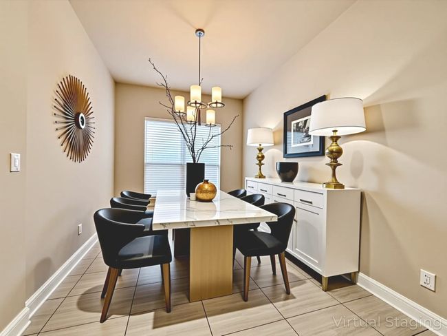 Dining area with a chandelier and baseboards | Image 20