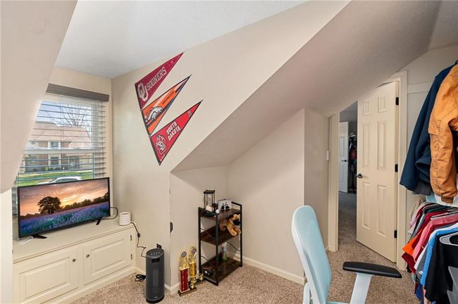 Carpeted office featuring lofted ceiling | Image 38