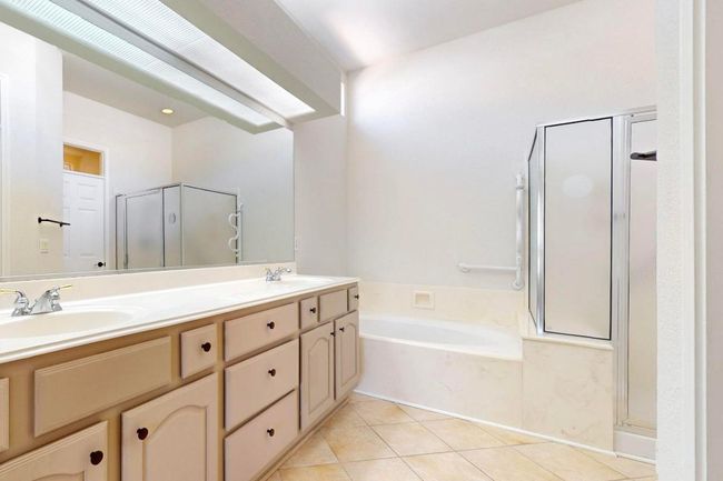 primary bath with soaking tub and separate shower: double sinks | Image 20