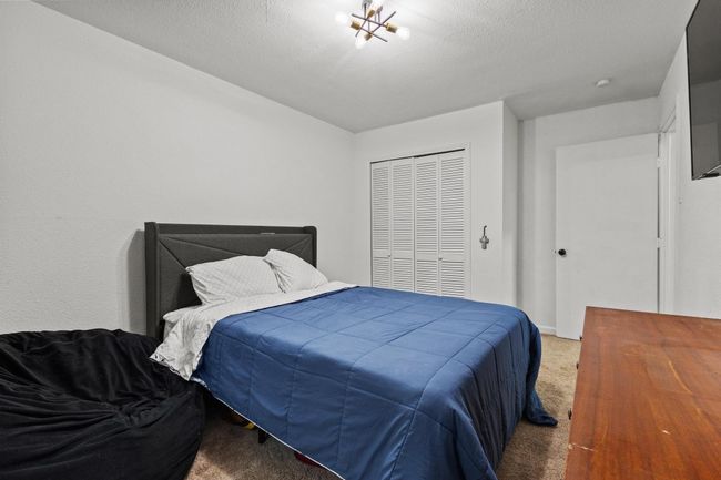 Carpeted bedroom featuring a closet | Image 21