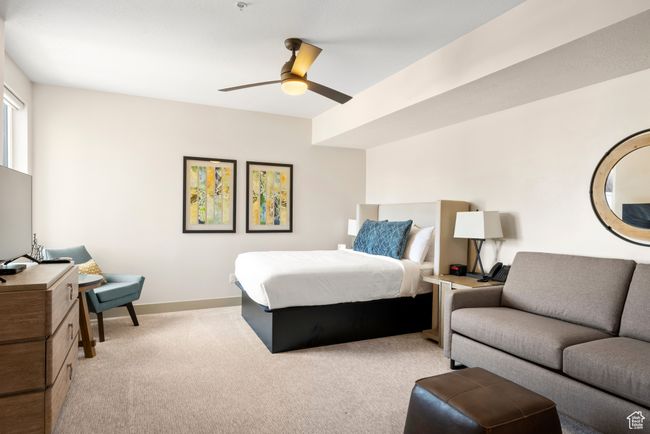 Bedroom featuring light carpet, baseboards, and a ceiling fan | Image 31