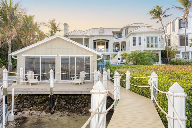 Looking back at the house and its super cute boathouse-cottage | Image 47