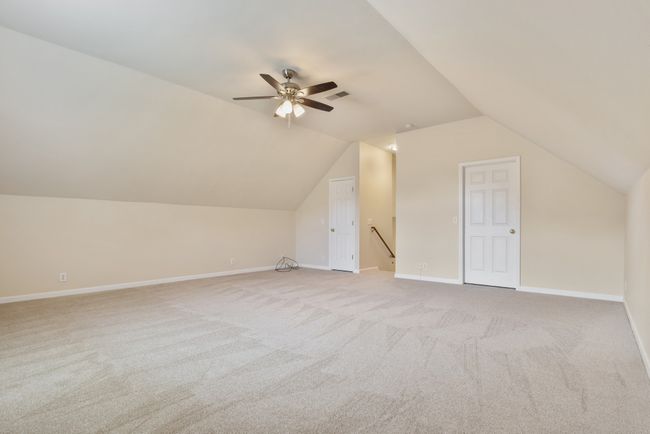 Bonus room has updated lighting, fresh paint, and new carpet. Ample additional storage for your treasures is easily accessible without stairs or ladders. | Image 24