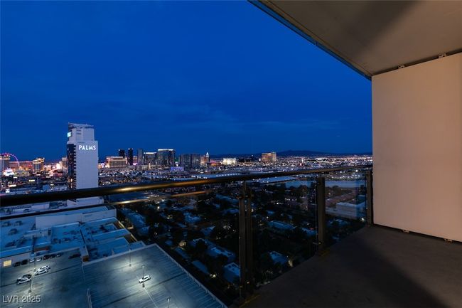 Balcony at twilight featuring a view of city lights | Image 39