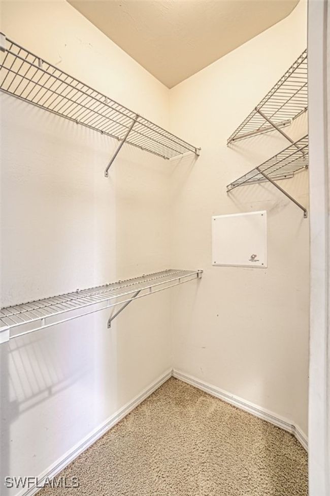 Walk in closet featuring carpet flooring | Image 32