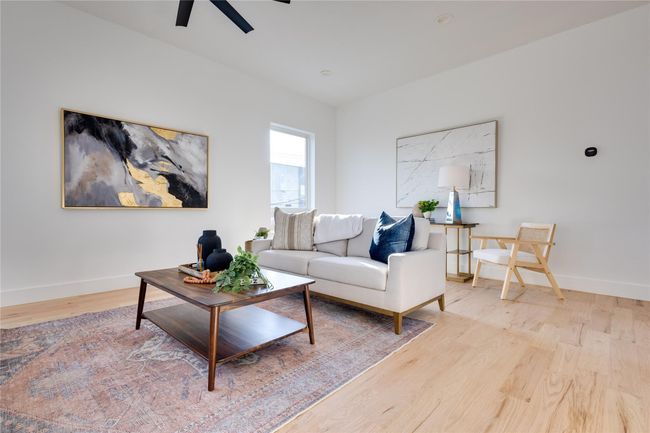 Living room featuring ceiling fan and light wood-type flooring | Image 22