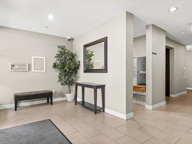 Corridor featuring light tile patterned floors and recessed lighting | Image 16