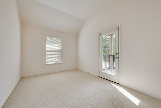 Carpeted spare room with healthy amount of natural light and lofted ceiling | Image 17