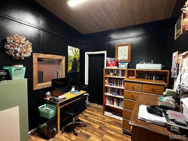 Office space with wooden ceiling, hardwood / wood-style floors, and vaulted ceiling | Image 9